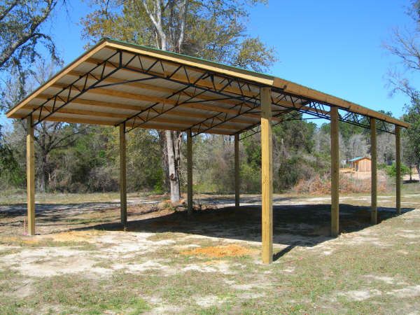 Open-sided wooden pole barn pavilion